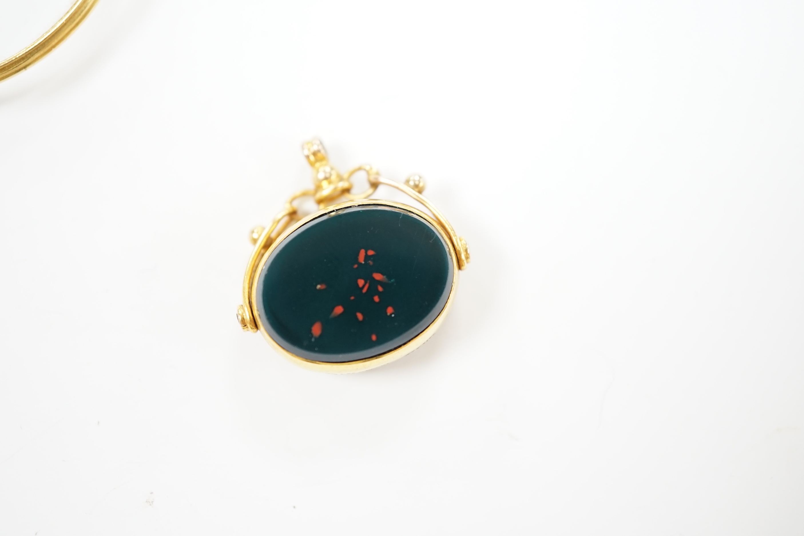 A George V 9ct gold mounted carnelian and bloodstone set spinning fob, width 21mm, together with a pair of gold plated lorgnettes.